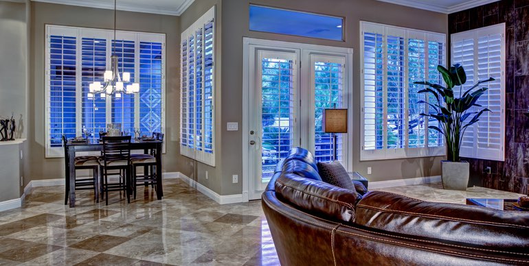 Fort Lauderdale great room with plantation shutters and modern lighting.